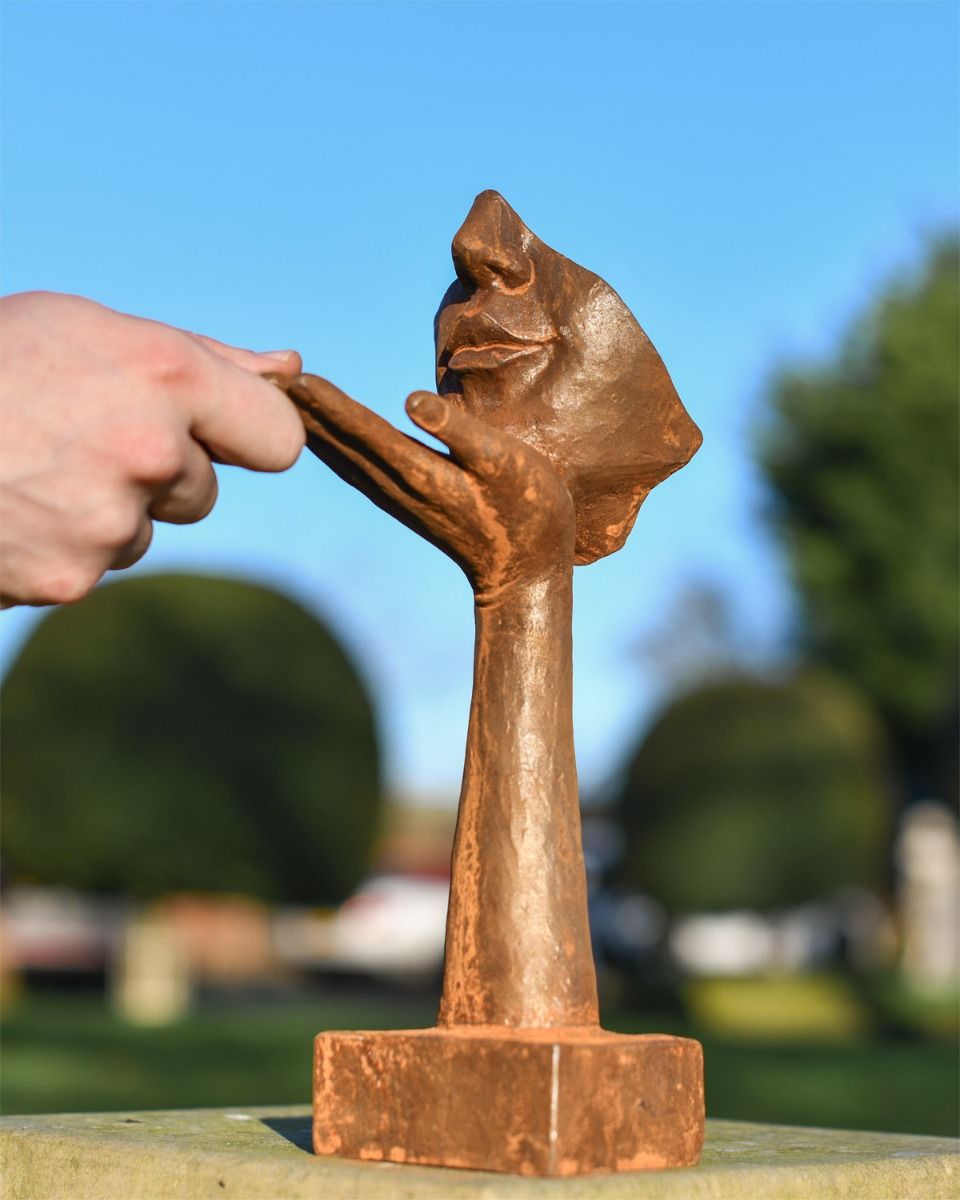 Rustic Cast Iron Blowing a Kiss Garden Sculpture Scale Shot 