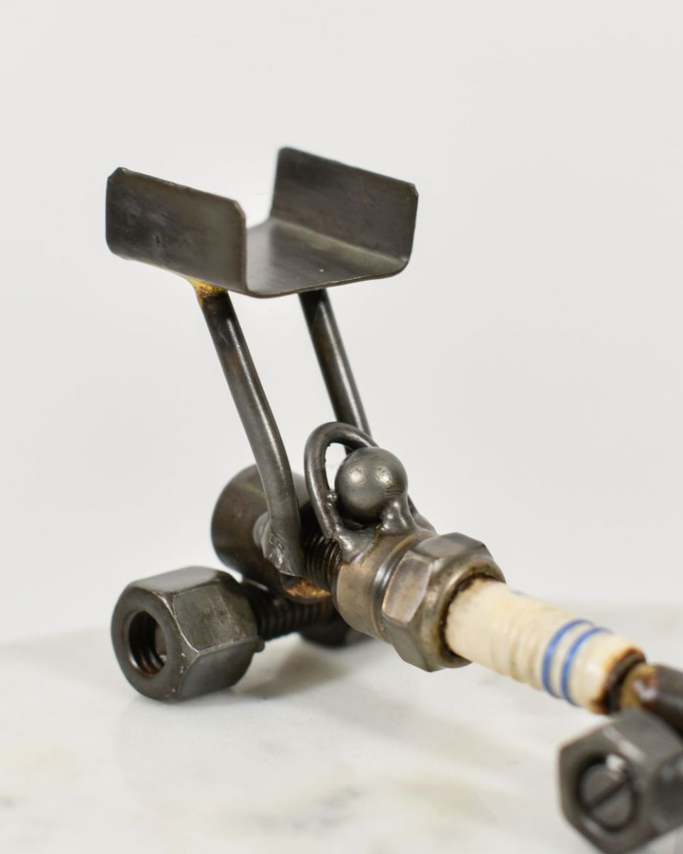 Close up of Spark Plug Drag Car Scrap Metal Sculpture cockpit