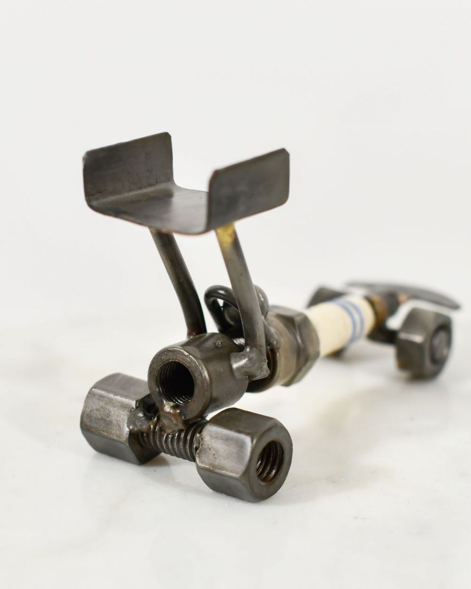 Close up of Spark Plug Drag Car Scrap Metal Sculpture Exhaust