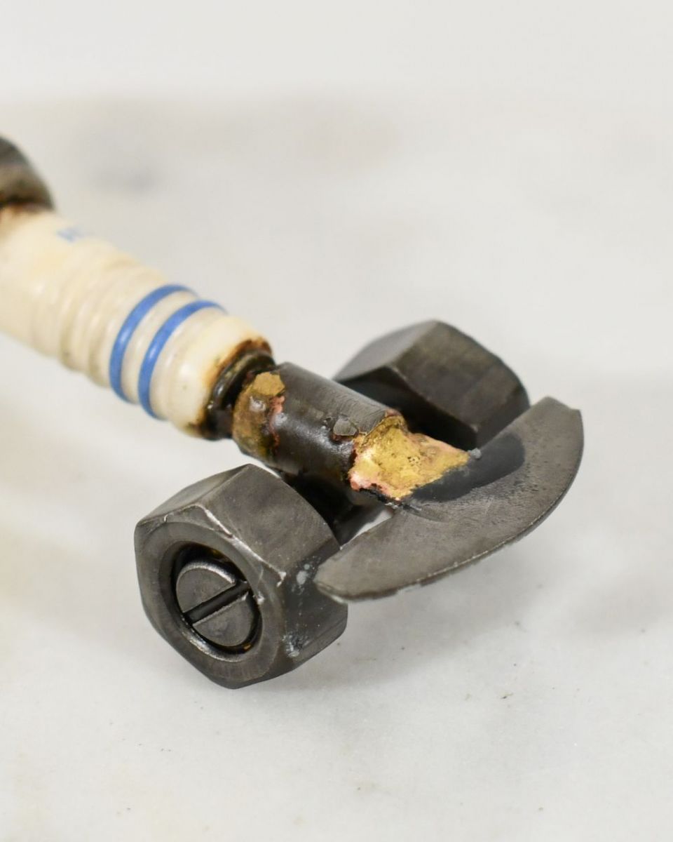 Close up of Spark Plug Drag Car Scrap Metal Sculpture splitter