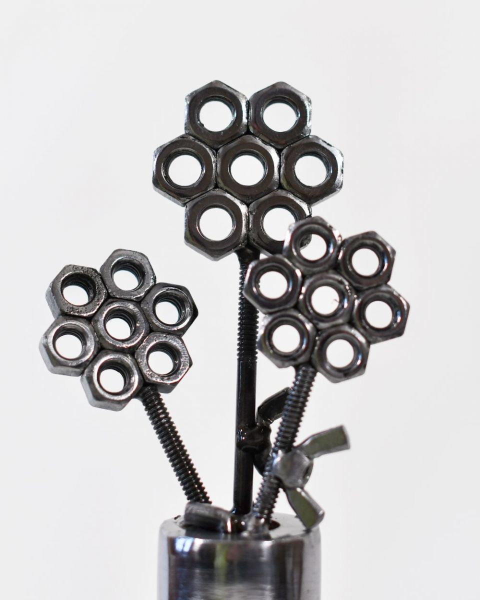 Close up of Scrap Metal Flower Pot Sculpture flower heads Close up of Scrap Metal Flower Pot Sculpture flower heads