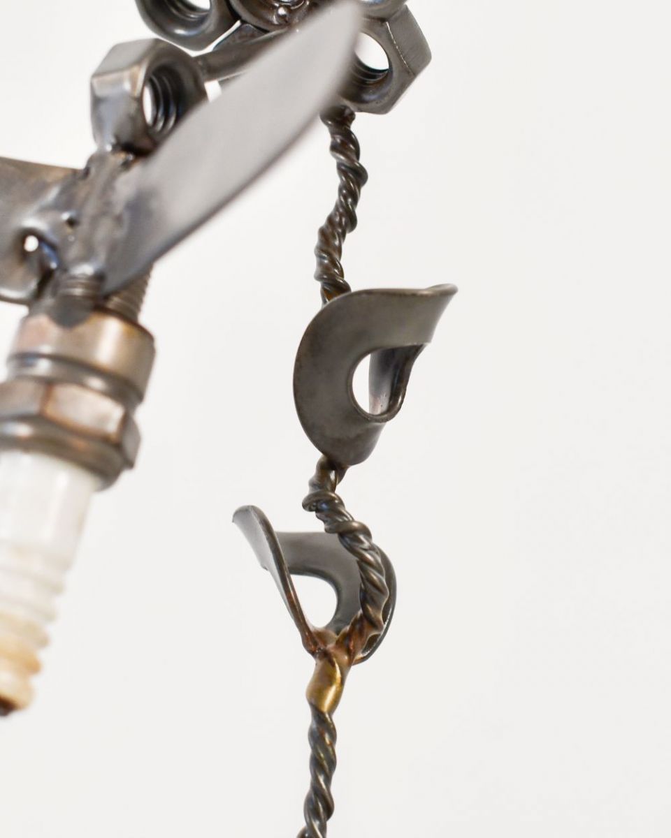 Close up of Spark Plug Hummingbird Recycled Metal Ornament stem Close up of Spark Plug Hummingbird Recycled Metal Ornament stem