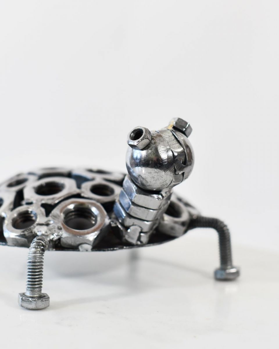 Close up of Scrap Metal Tortoise Hatchling Sculpture head