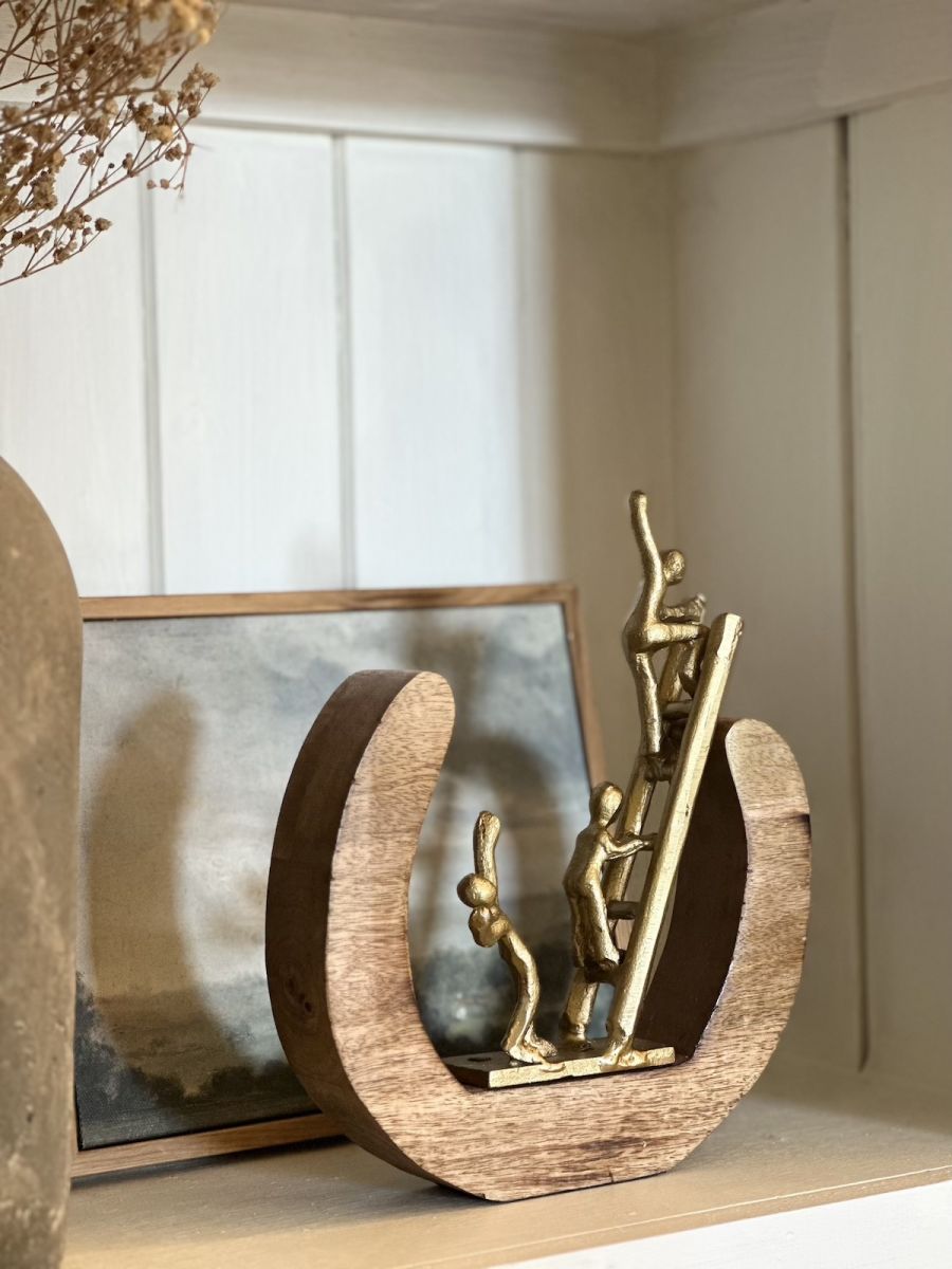 Angled back view of aluminium and mango wood art sculpture Angled back view of aluminium and mango wood art sculpture