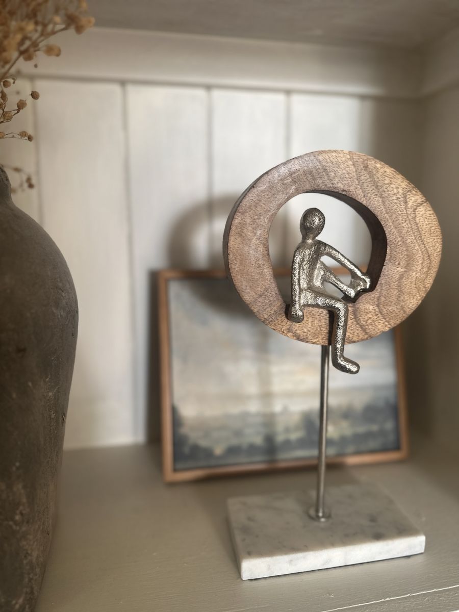 In situ photo of silver aluminium, mango wood and marble art sculpture