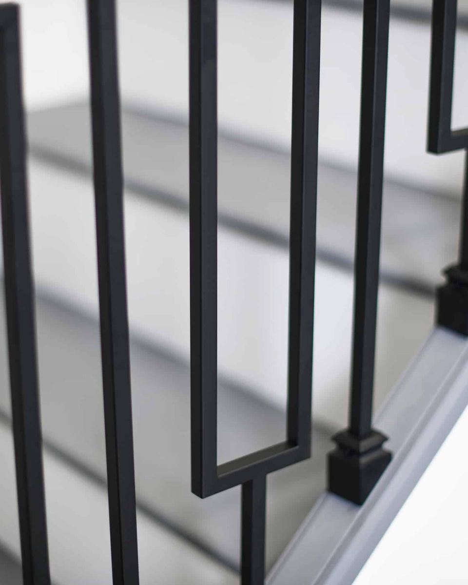 Close-Up of Set of 2 Matte Black "Enfield" Steel Stair Spindles - Pattern 10