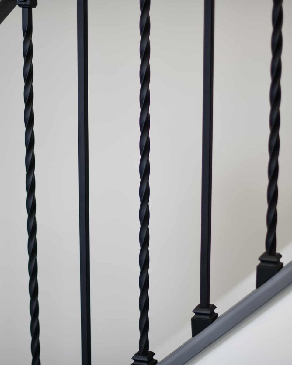 Close-Up Shot of Pair of Alternating Stair Spindles Close-Up Shot of Pair of Alternating Stair Spindles