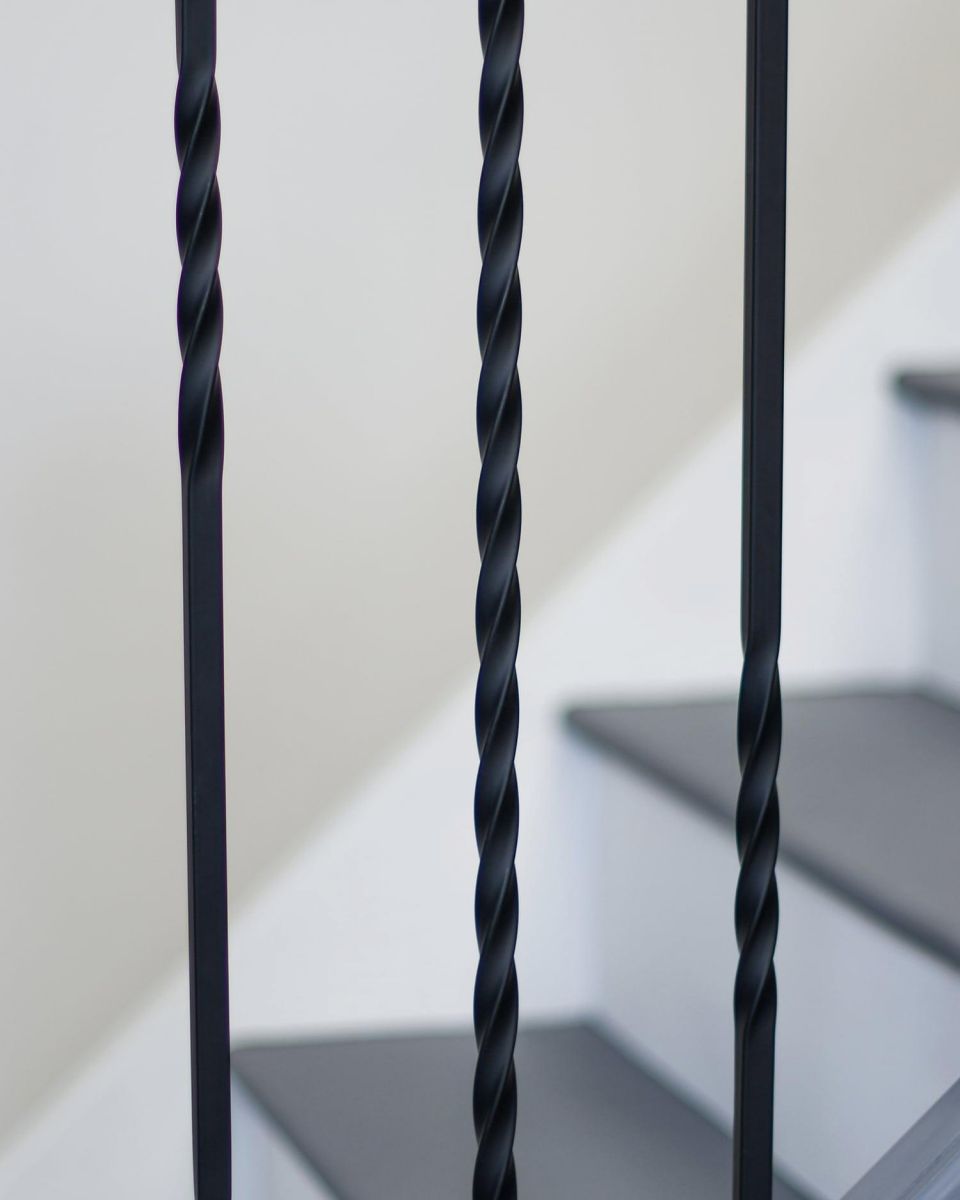 Close-Up of Set of 2 Matte Black "Enfield" Steel Stair Spindles - Pattern 12 - Spindle ONLY - No Brackets