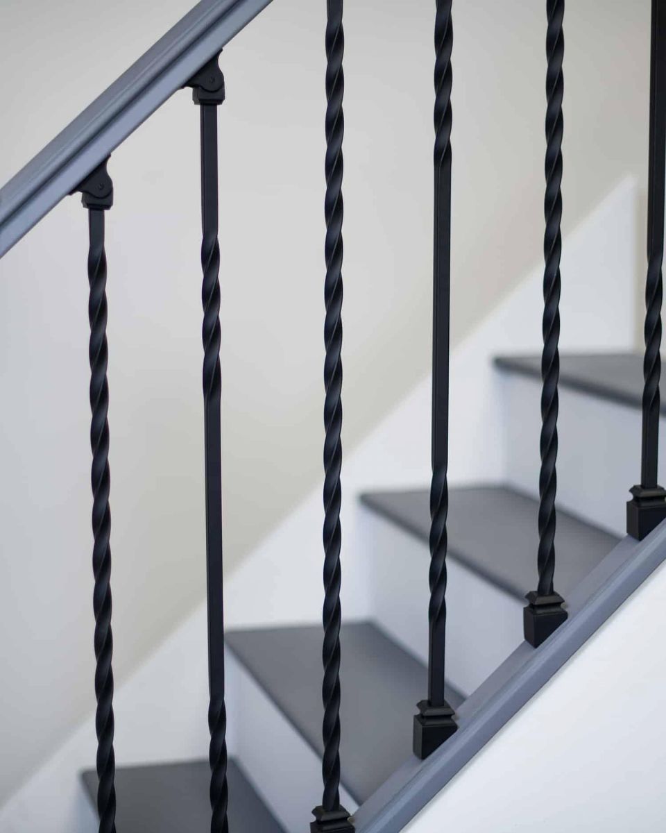 Close-Up of Set of 2 Matte Black "Enfield" Steel Stair Spindles - Pattern 12
