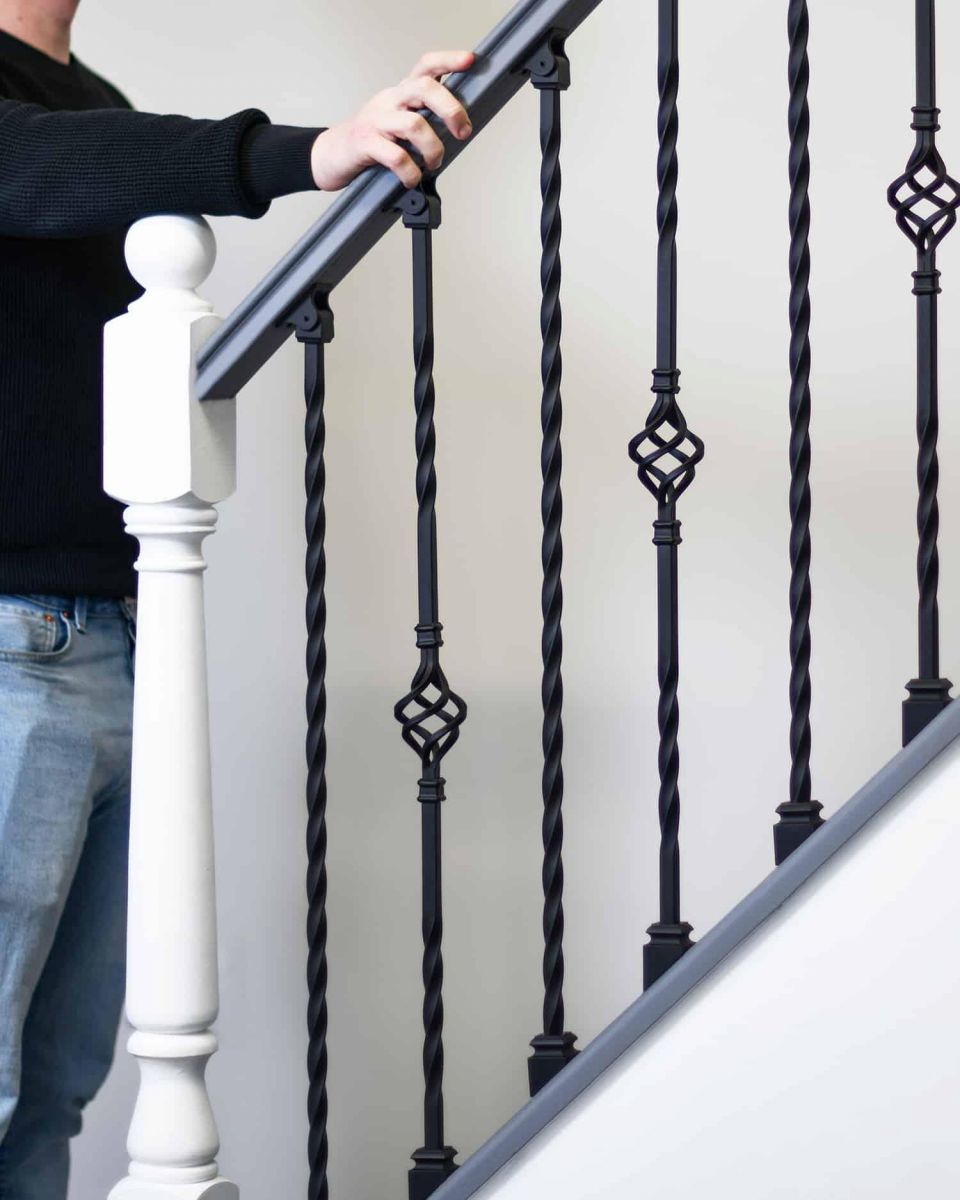 Scale Shot of Set of 2 Matte Black "Enfield" Steel Stair Spindles - Pattern 13