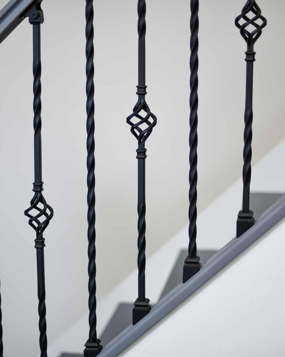 Close-Up of Set of 2 Matte Black "Enfield" Steel Stair Spindles - Pattern 13