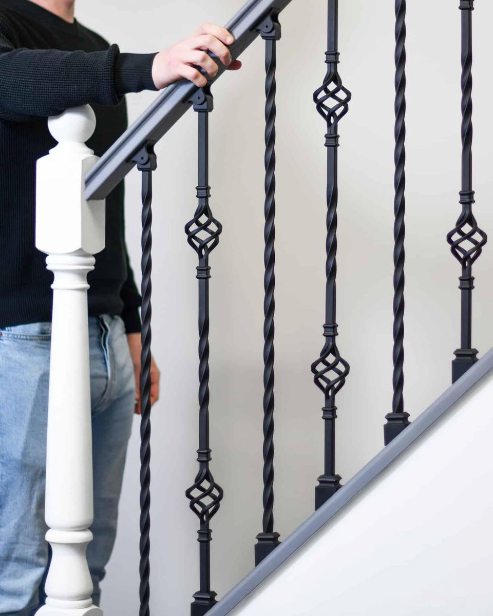 Scale Shot of Set of 2 Matte Black "Enfield" Steel Stair Spindles - Pattern 14