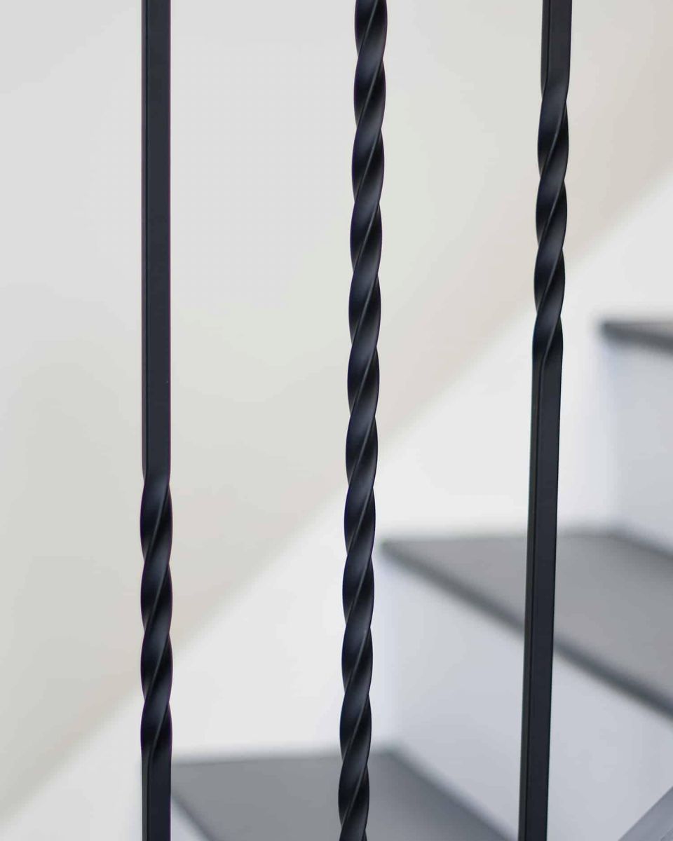 Close-Up of Set of 2 Matte Black "Enfield" Steel Stair Spindles - Pattern 15 - Spindle ONLY - No Brackets