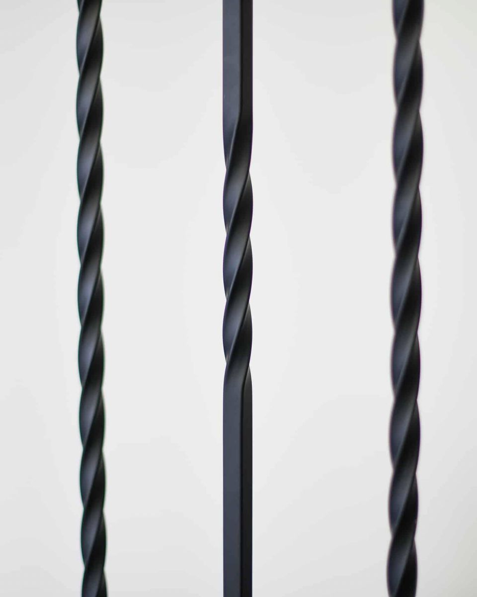 Close-Up of Set of 2 Matte Black "Enfield" Steel Stair Spindles - Pattern 15