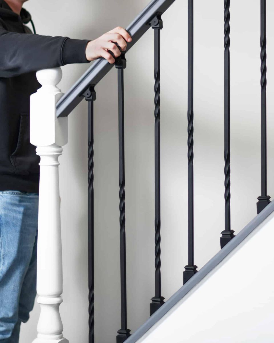 Scale Shot of Set of 2 Matte Black "Enfield" Steel Stair Spindles - Pattern 4