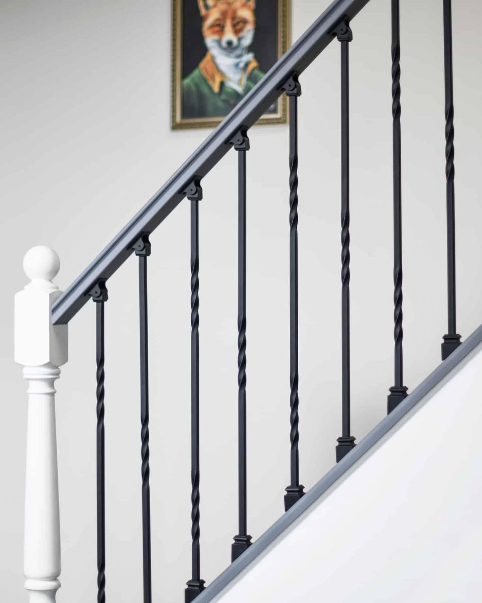 Set of 2 Matte Black "Enfield" Steel Stair Spindles - Pattern 4 in Situ