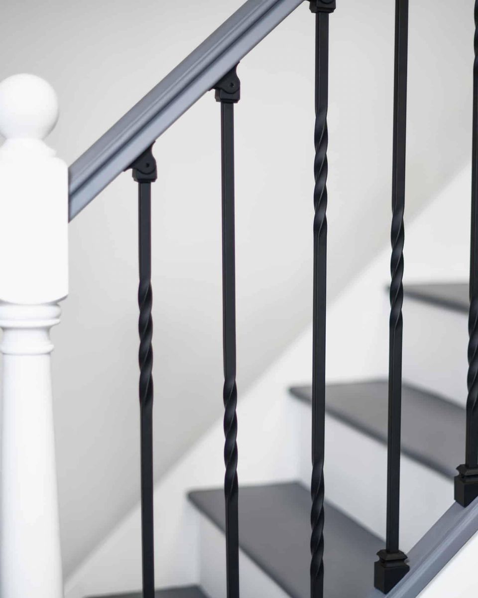Set of 2 Matte Black "Enfield" Steel Stair Spindles - Pattern 4 in Situ