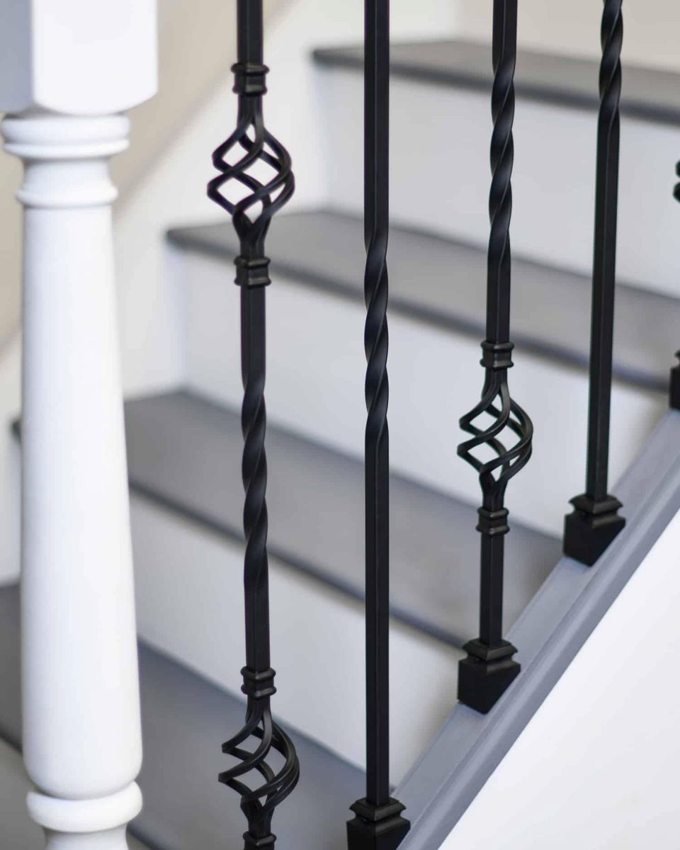 Close-Up of Set of 2 Matte Black "Enfield" Steel Stair Spindles - Pattern 7 in Situ