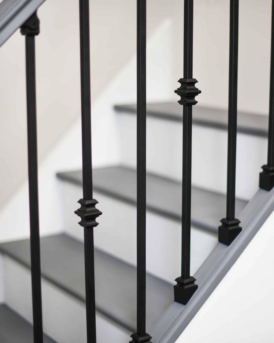 Close-Up of Set of 2 Matte Black "Enfield" Steel Stair Spindles - Pattern 8
