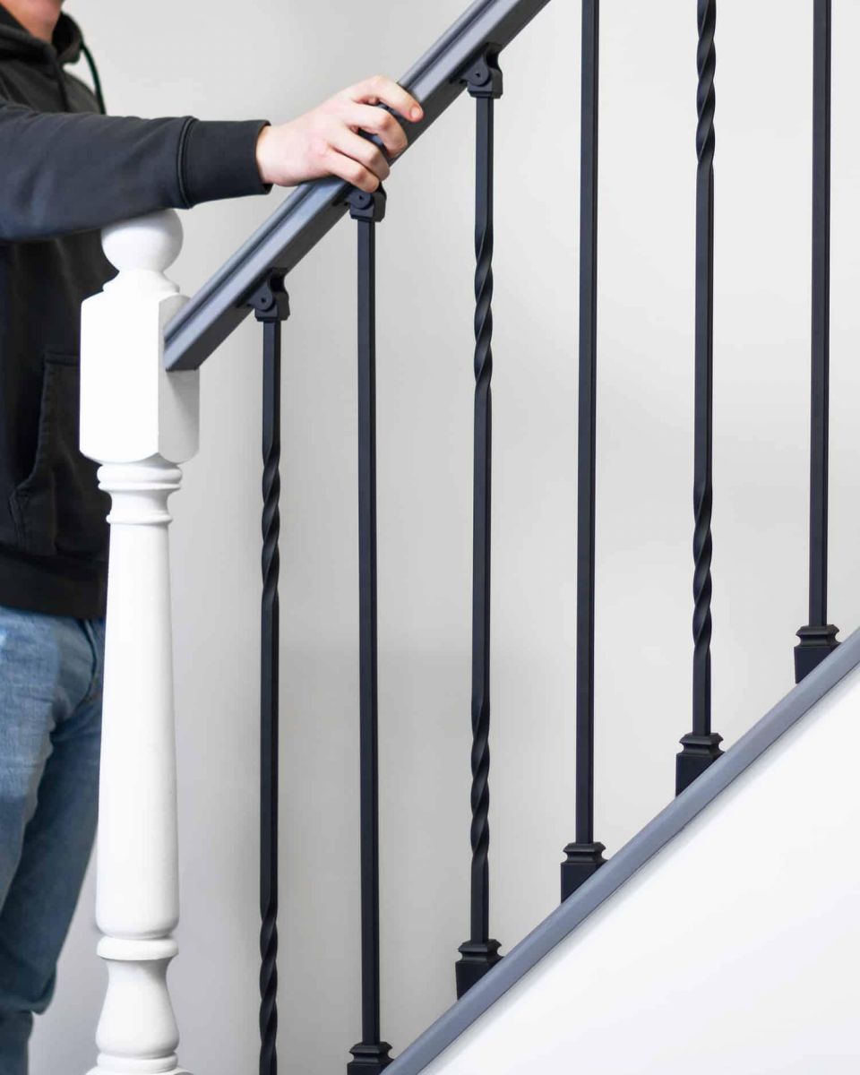 Scale Shot of Set of 2 Matte Black "Enfield" Straight & Double Twist Stair Spindles - Pattern 2