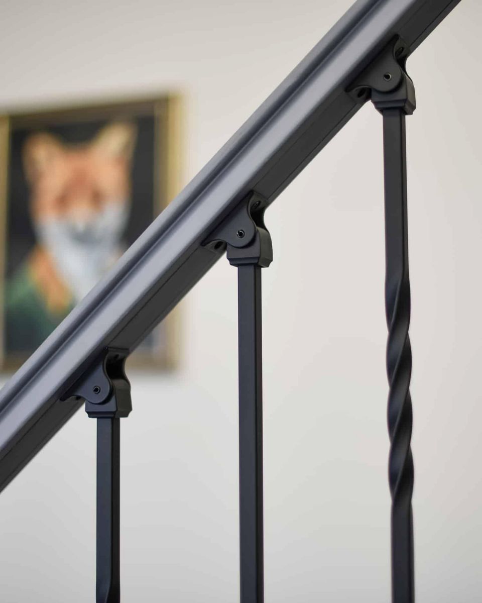 Close-Up of Set of 2 Matte Black "Enfield" Straight & Double Twist Stair Spindles - Pattern 2 with Adjustable Rake Brackets