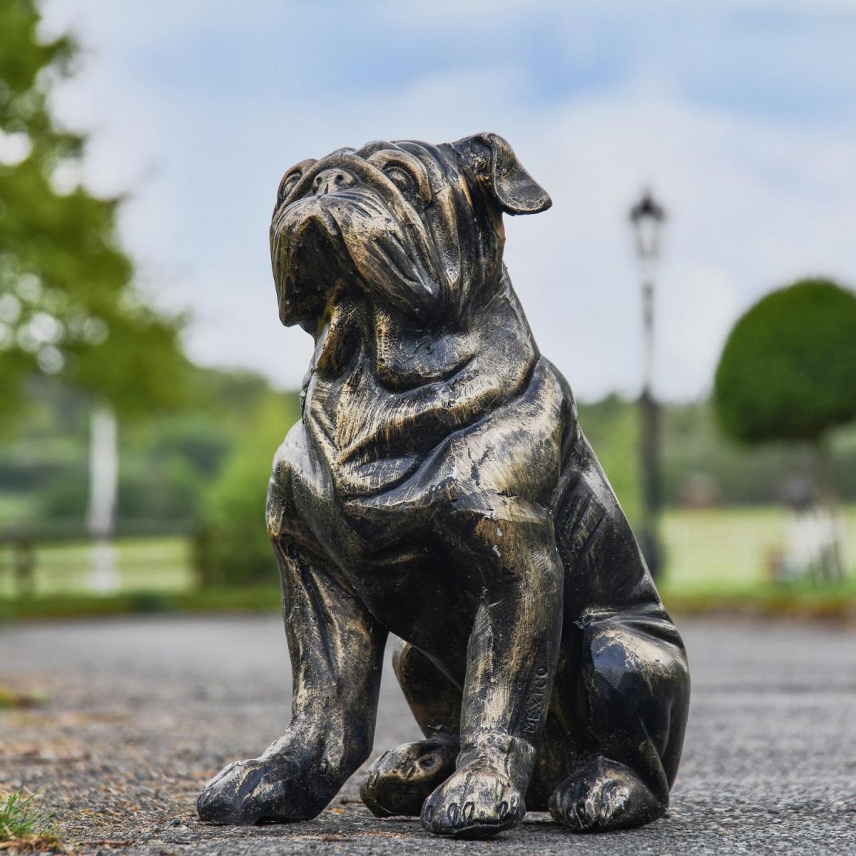 Brushed Gold Bulldog Sculpture in Garden Setting  Brushed Gold Bulldog Sculpture in Garden Setting