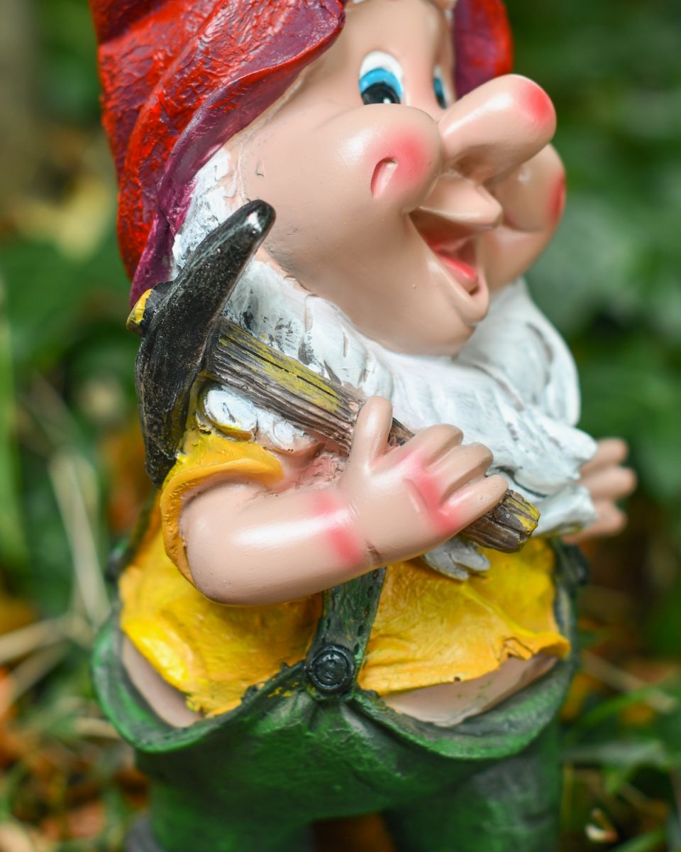 Side on close up of colourful gnome statue