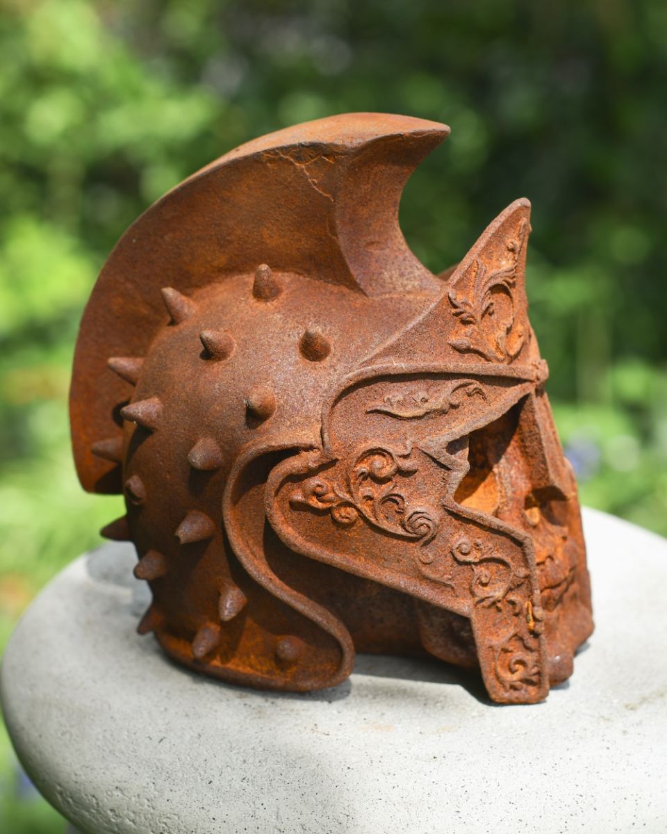 side profile of cast iron roman gladiator skull garden ornament