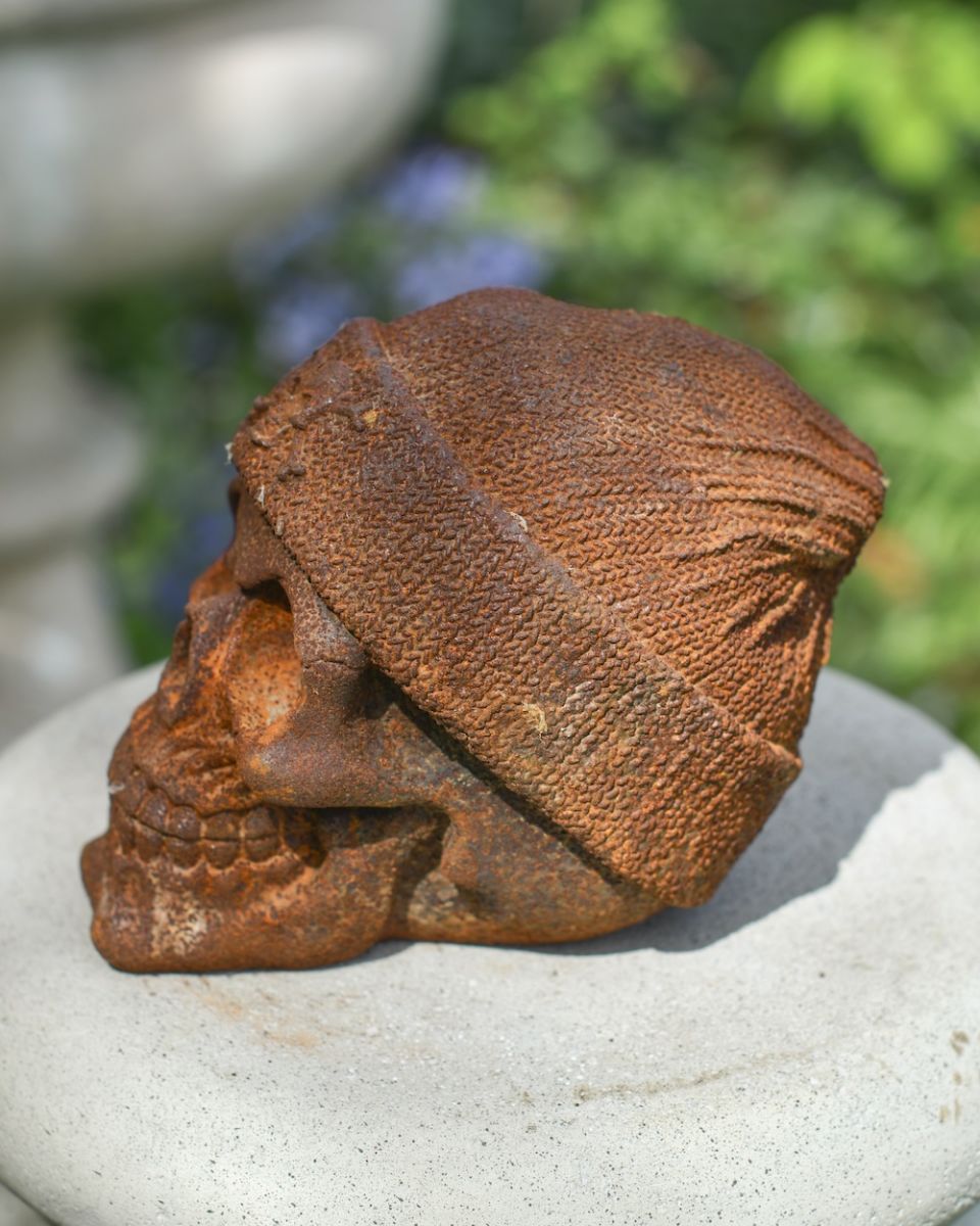side view of rustic finish skull garden ornament