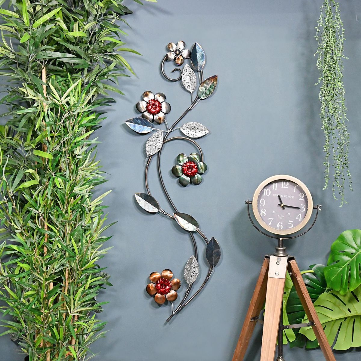 Silver Metallic Flower Wall Art in Situ on a Blue Wall