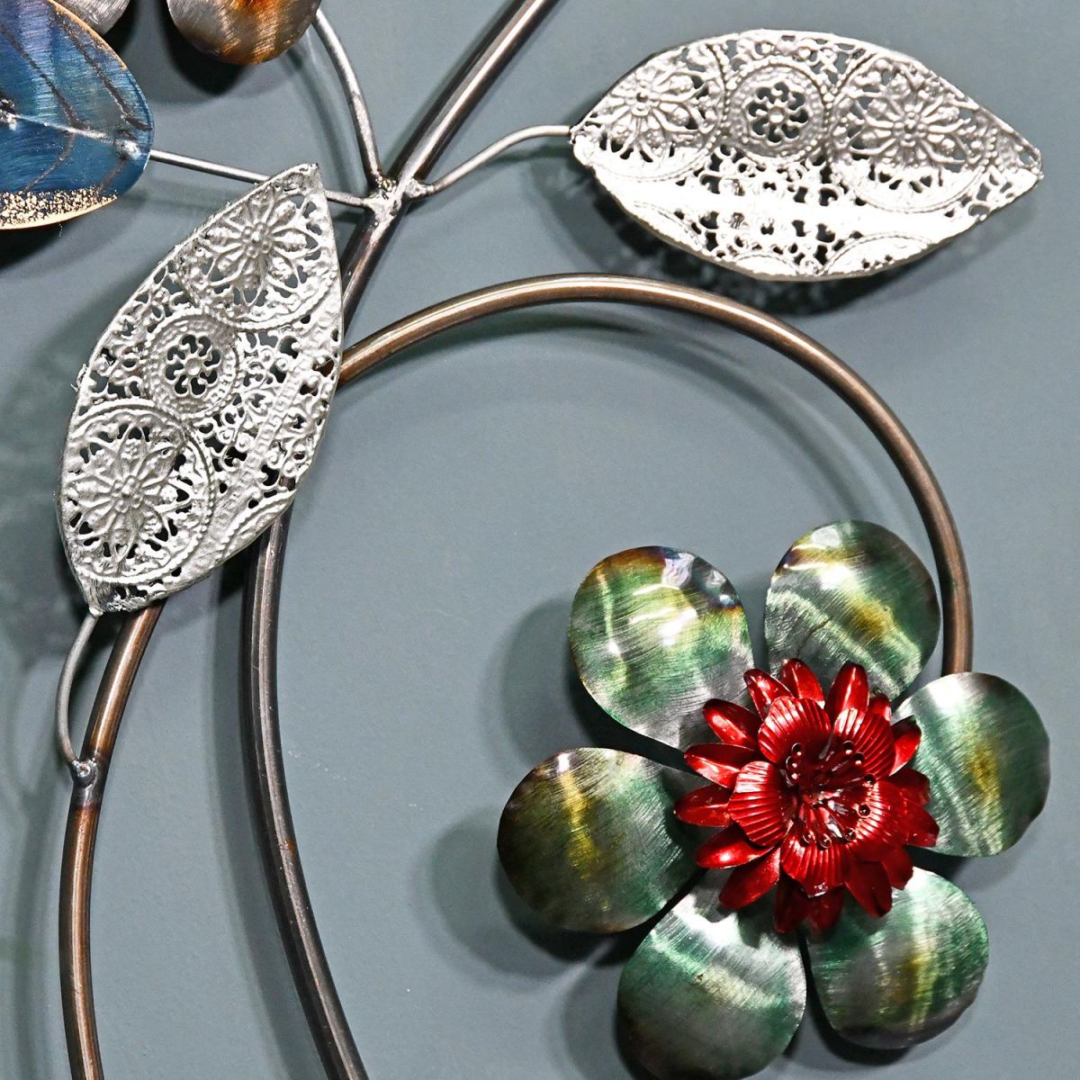 Close-up o fthe Metallic Green and Red Flower on a Silver Leaf Branch