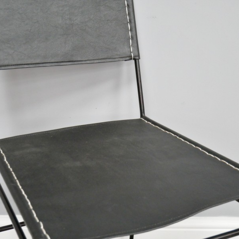 Close-up of the Black Leather on the Seat of the Chair Close-up of the Black Leather on the Seat of the Chair