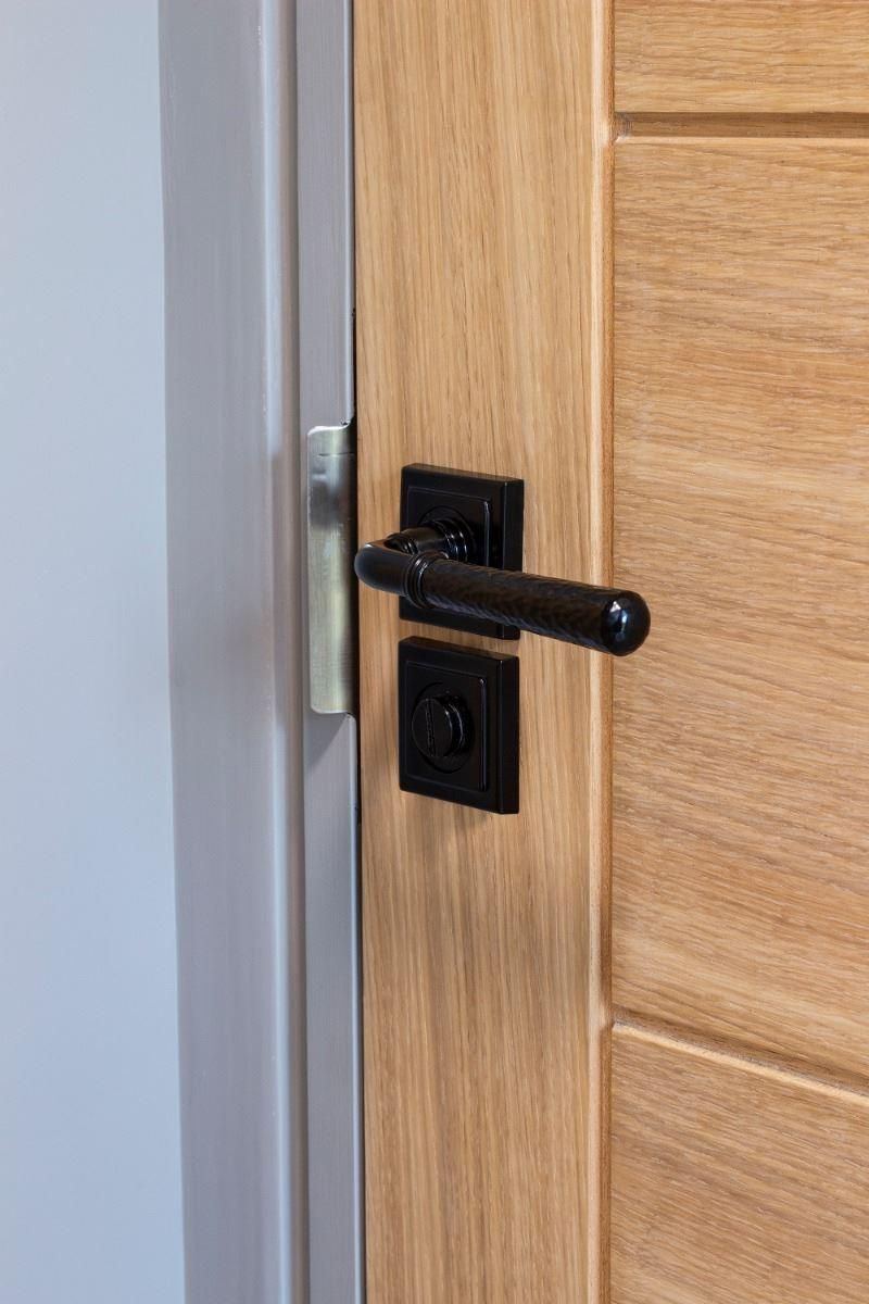 Sleek Black Square Thumbturn Set with Plain Cover on Door