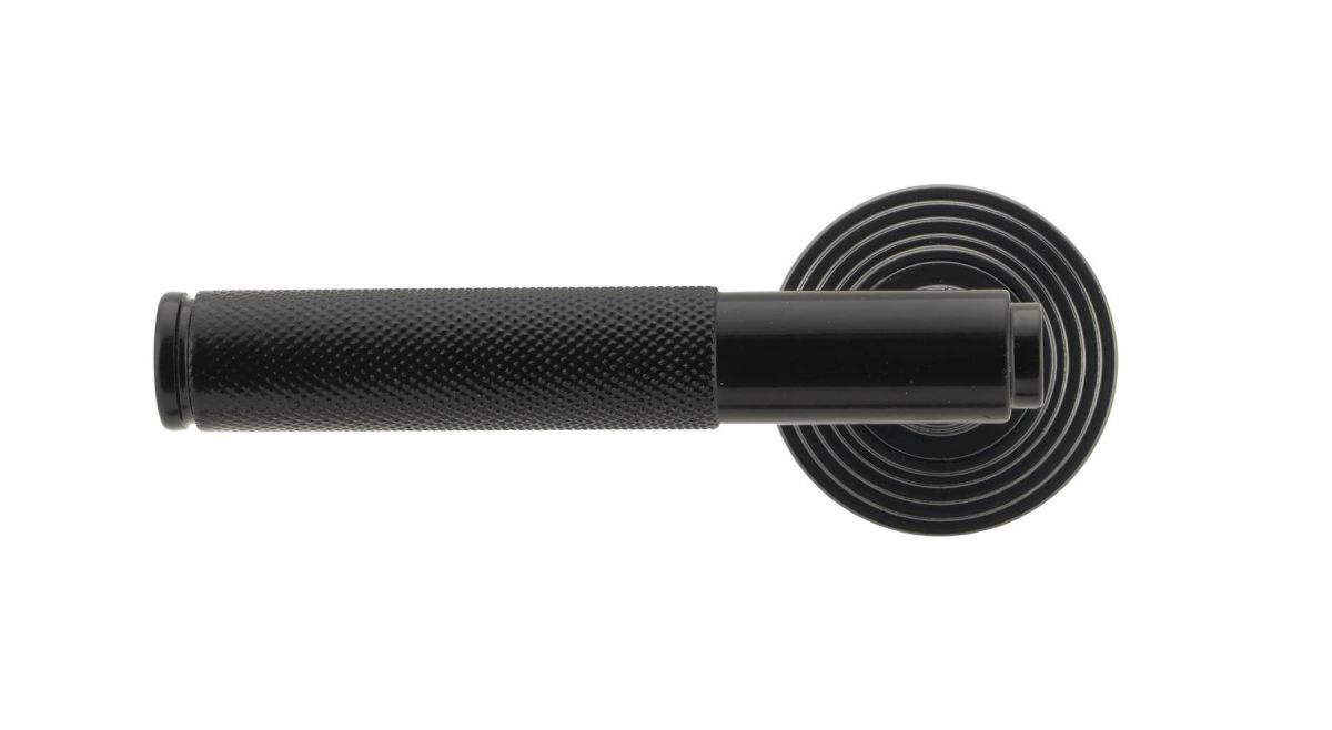 Sleek Black Textured Unsprung Lever Door Handle on Beehive Rose