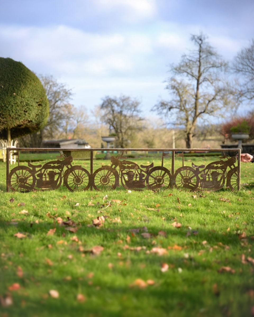 ‘Bullet’ Rustic Wall Art of a Vintage Motorbike to scale with hand holding wall art upright