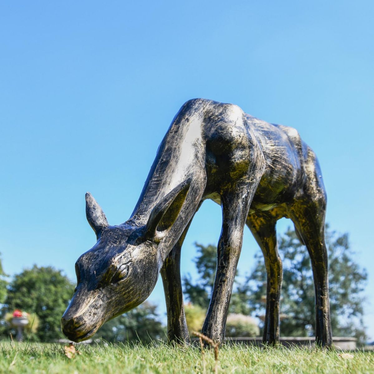 Small Recycled Cast Aluminium Brushed Gold Grazing Doe Sculpture in Situ