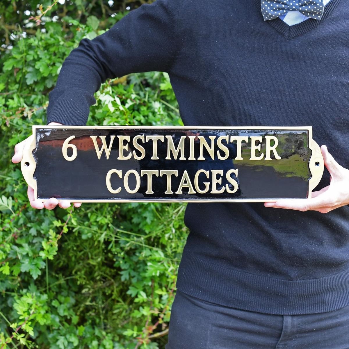 Large Black and Brass House Name sign in hands