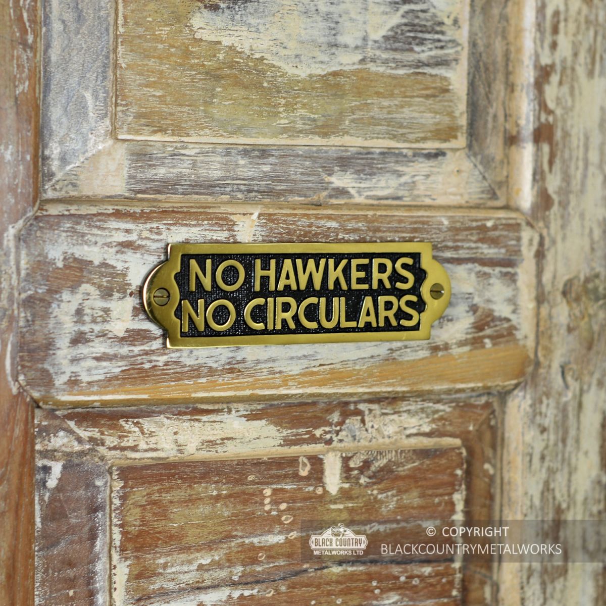 Side View of the "No Hawkers No Circulars" Sign