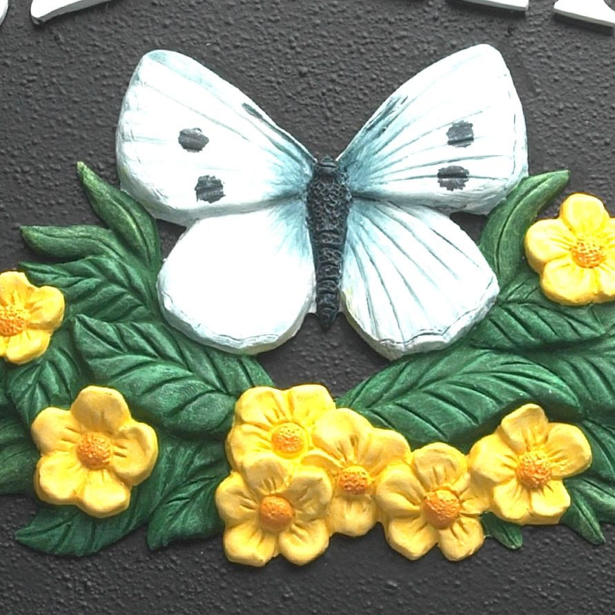 Close up detailed image of hand painted butterfly motif