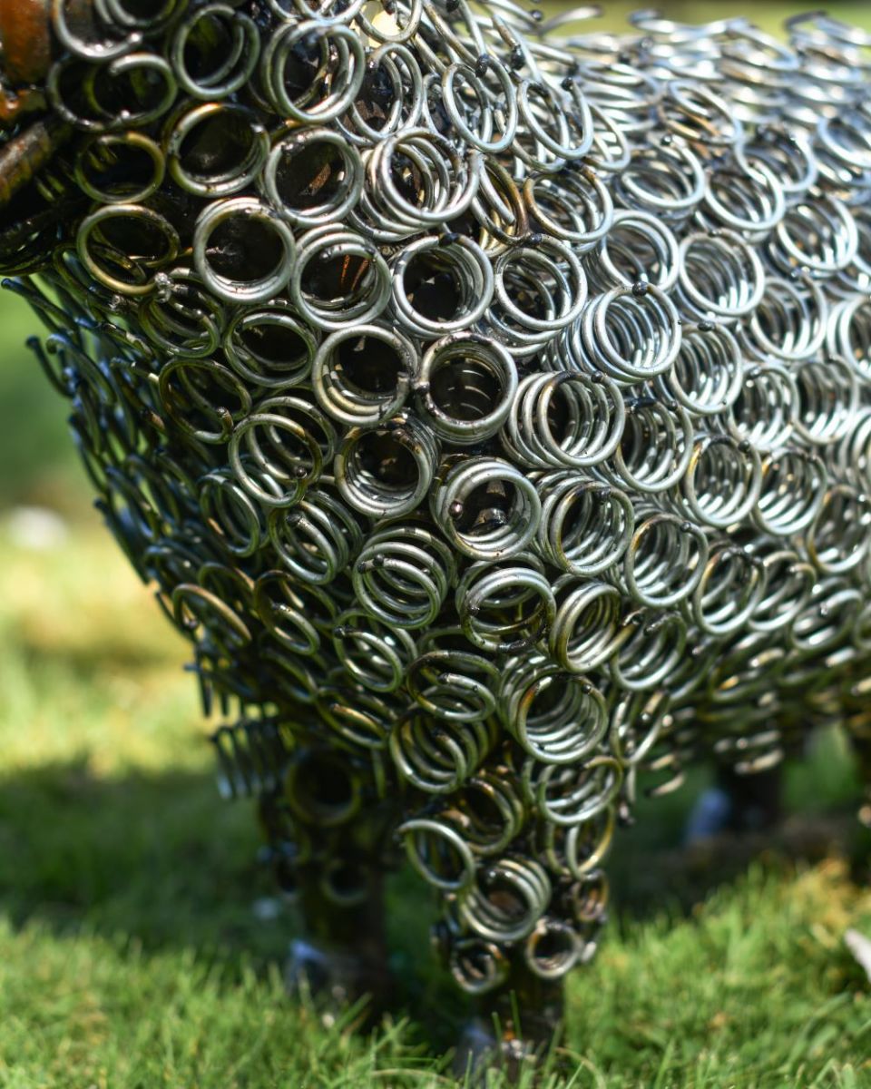 Close up of Rustic Bedspring Sheep Sculpture front leg
