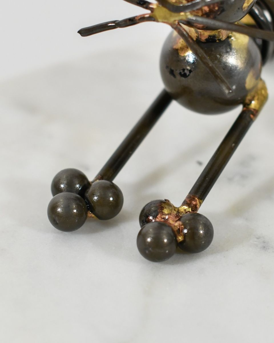 Close up of intricate paw detail on recycled metal art sculpture Close up of intricate paw detail on recycled metal art sculpture