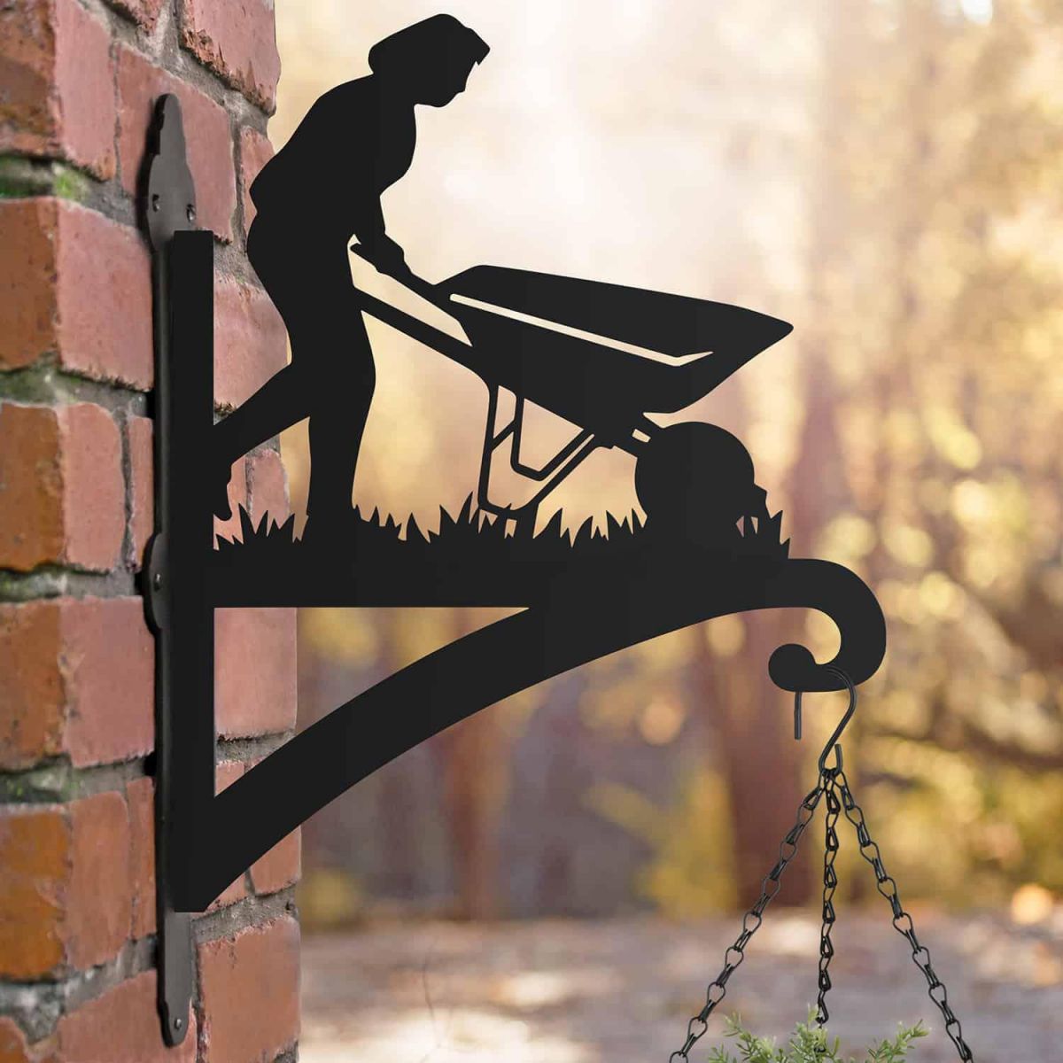 Steel Female Gardener with Wheelbarrow Hanging Basket Bracket in Situ Steel Female Gardener with Wheelbarrow Hanging Basket Bracket in Situ