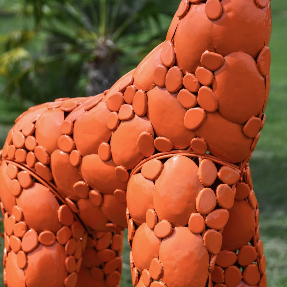 Close-Up of Steel "Lady Jengo" Baby Giraffe Sculpture - Orange