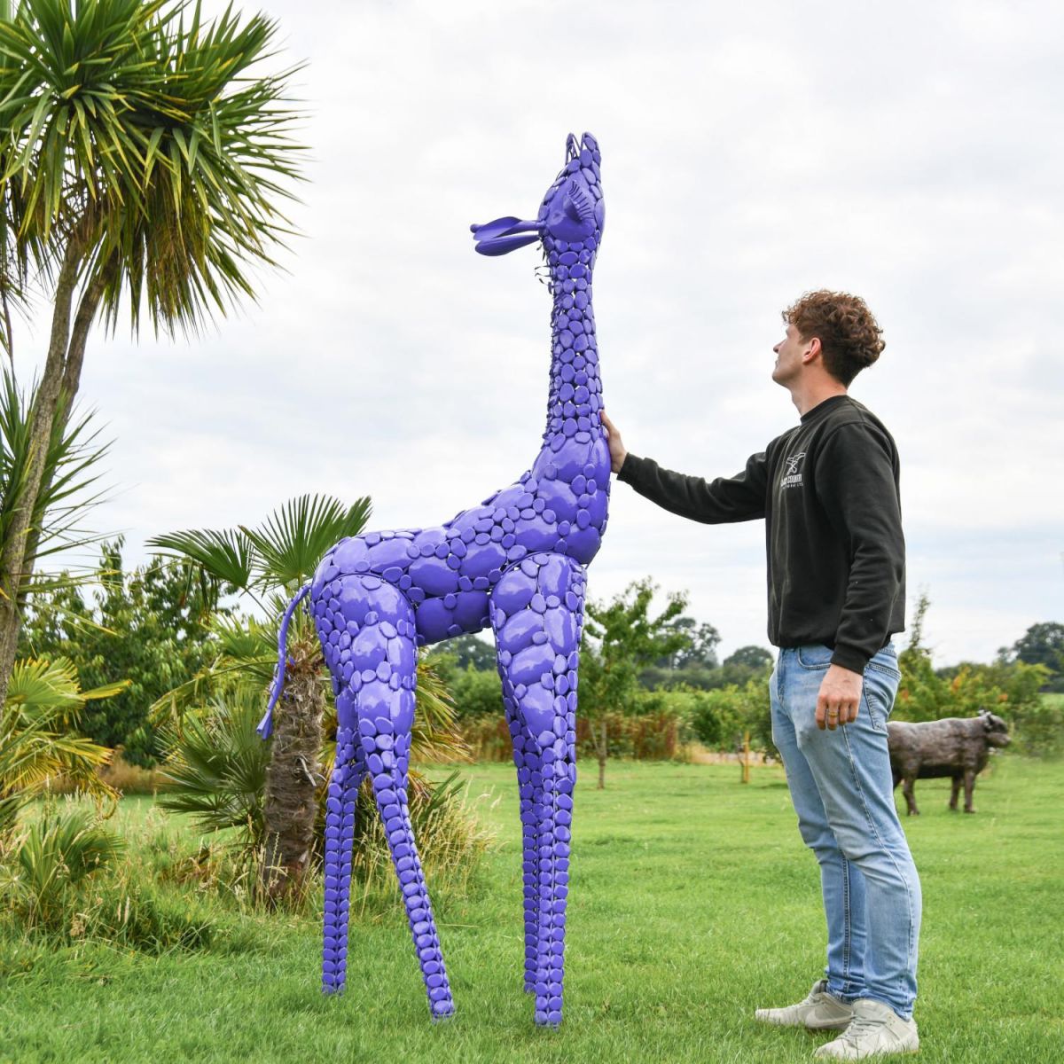 Scale Shot of Steel "Lady Jengo" Baby Giraffe Sculpture - Purple
