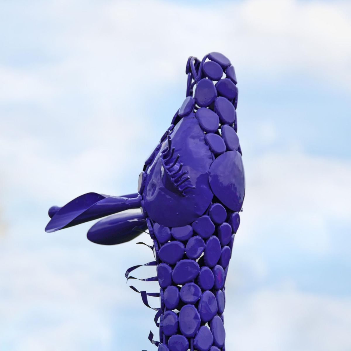 Close-Up of Purple Steel "Lady Jengo" Baby Giraffe Sculpture
