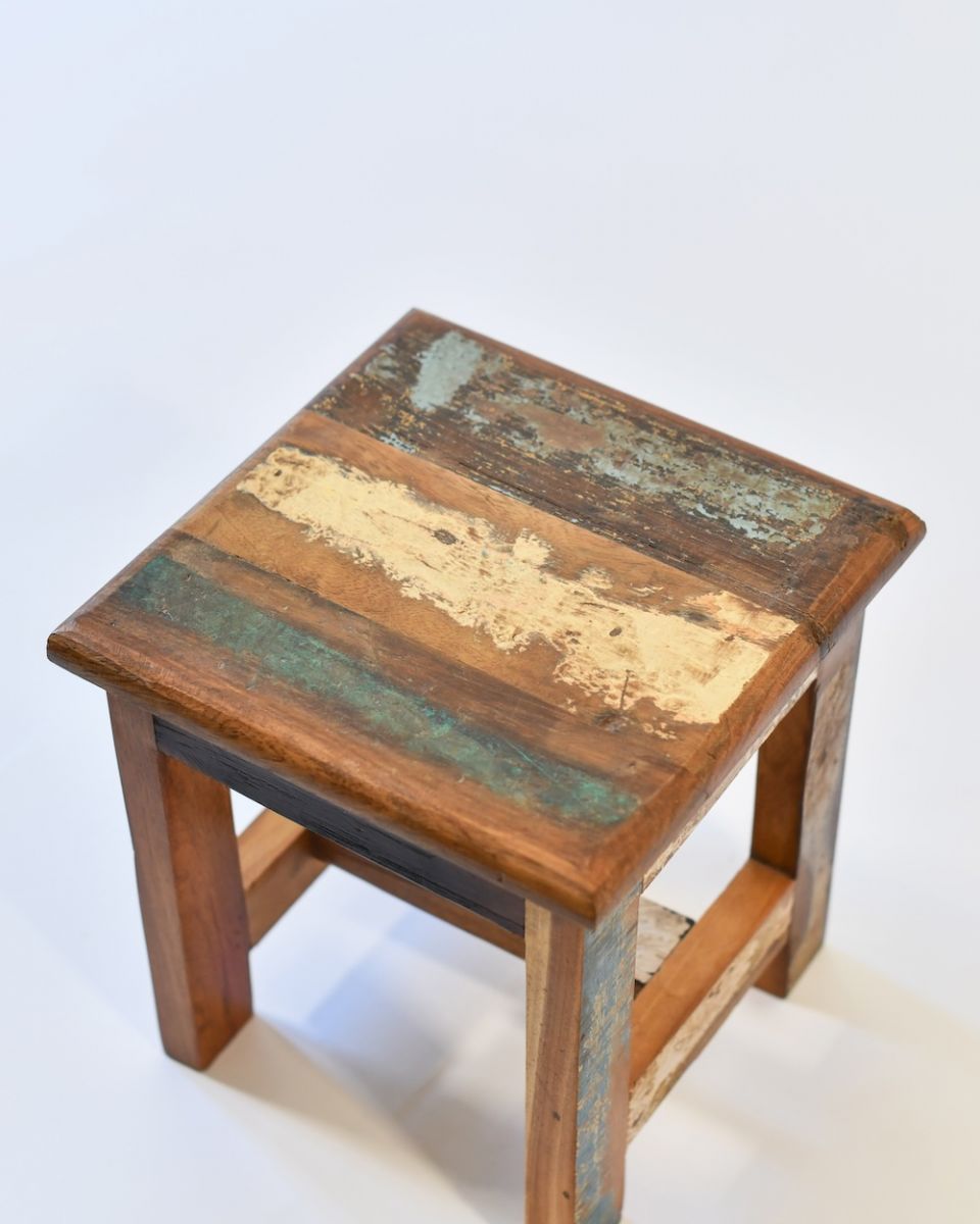 Close up of rustic top on reclaimed wooden stool Close up of rustic top on reclaimed wooden stool