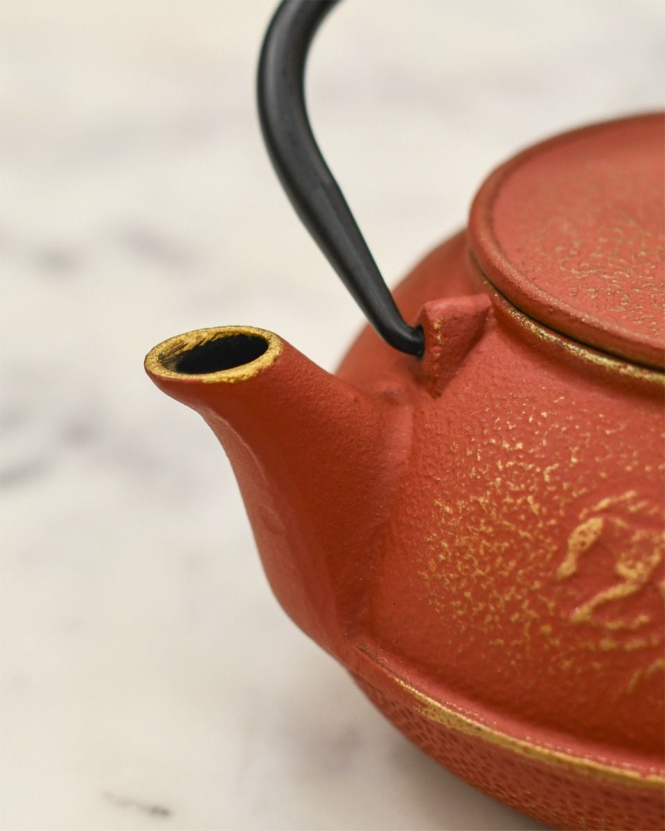 Close up of Gold Detail on Cast Iron Teapot Spout 