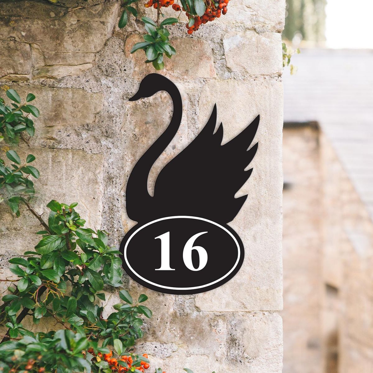Bespoke Swan Iron House Number Sign on a Garden Wall