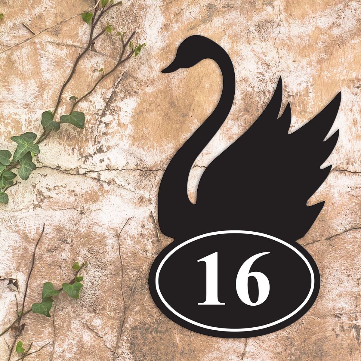 Swan Iron House Number Sign in Situ on a Rustic Wall 