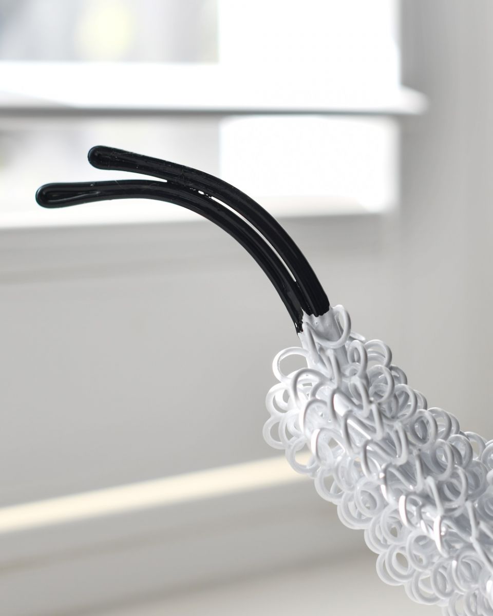 close up of tail on cockerel sculpture